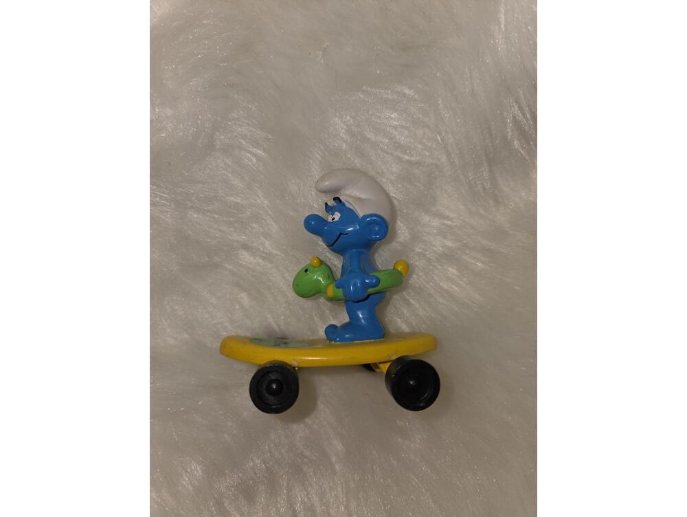 Vintage Smurf Skateboard Figure with Green Dinosaur Toy